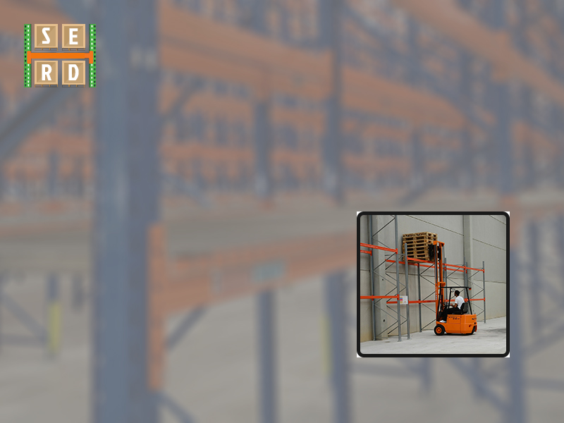 structural-steel-rack-being-loaded-with-storage-items-with-a-forklift
